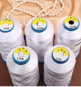 Five spools of professional white bead stringing thread in various sizes for DIY jewelry