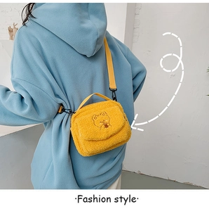 Detailed close-up of yellow fuzzy lamb wool crossbody bag with cute bear embroidery detail