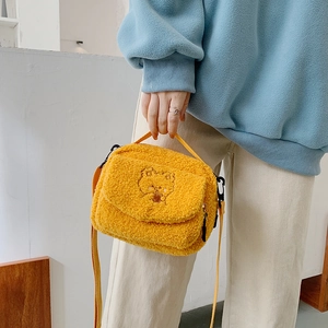 Yellow fluffy faux shearling crossbody bag with cute bear embroidery and matching strap