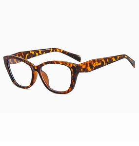 Detailed macro view of cat-eye tortoiseshell frames with clear lenses and inner arm specs