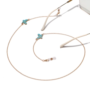 Chaîne de lunettes punk dorée avec pendentifs papillon en turquoise et attaches silicone