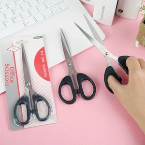 S002 Black Stainless Steel Household Scissors with ergonomic plastic handles on a desk