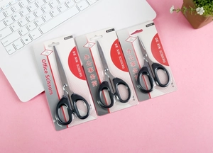 Three sizes of black stainless steel office scissors in blister card packaging