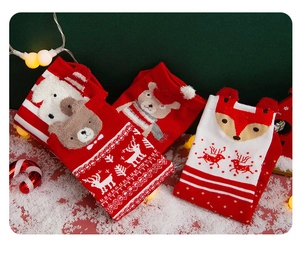 Detailed view of red Christmas socks featuring 3D cartoon bears and festive reindeer patterns