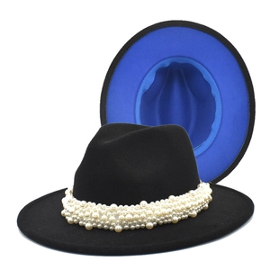 Detail of wool fedora with pearl band decoration and vibrant cobalt blue lining