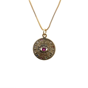Gold evil eye necklace with colorful cubic zirconia and radiant sunburst pendant