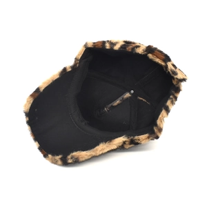 Detailed top view of leopard print faux fur baseball cap with soft black fabric lining