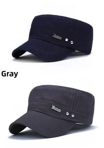 Detail of grey and navy cotton flat top military caps with Venture metal logo plaques