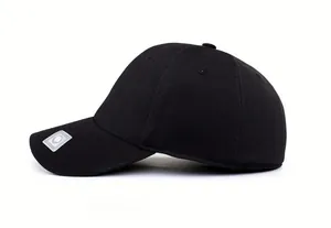 Detailed side view of black fitted baseball cap showing textured breathable fabric