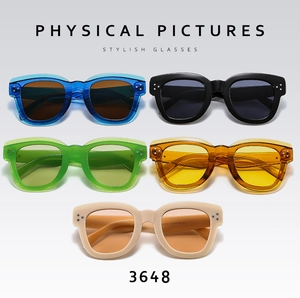 Flat lay of retro rectangle sunglasses in various colors with metallic dot details