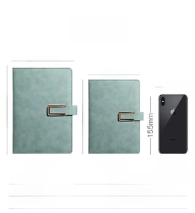 Size comparison of sage green faux leather B5 and A5 notebooks with magnetic buckle closure