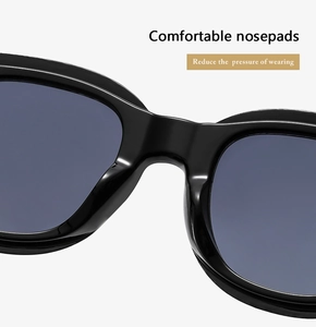 Detail of integrated wide nose pads on black sunglasses for pressure-free comfort