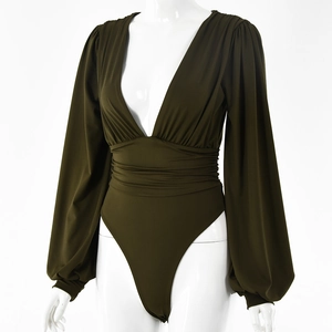 Detail view of olive green deep V-neck long sleeve bodysuit with ruched waist texture
