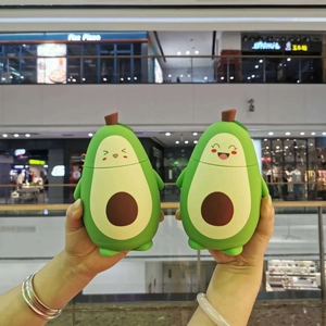 Close-up of cute avocado double-walled glass cups with adorable cartoon faces