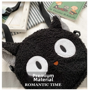 Close-up of black plush cat-shaped crossbody bag featuring textured lamb fleece fabric