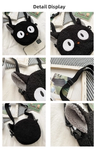 Detailed close-up of a black plush cat shoulder bag with soft texture and adjustable strap
