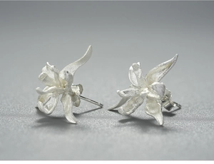 Macro shot of S925 sterling silver iris flower earrings with matte brushed texture