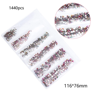 Detailed view of 1440pcs multi-faceted AB crystal rhinestones in a 6-compartment storage bag