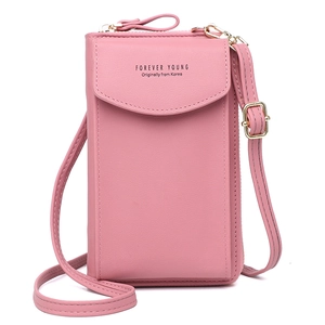 Pink minimalist crossbody phone bag with adjustable shoulder strap and gold hardware