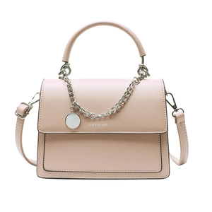Pink minimalist crossbody flap handbag with metallic chain and fashion text on white background