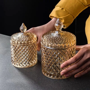 Detailed close-up of amber diamond-textured glass storage jars in two different sizes