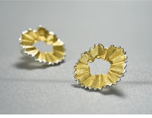 Macro shot of pencil shavings inspired S925 sterling silver studs in gold and silver