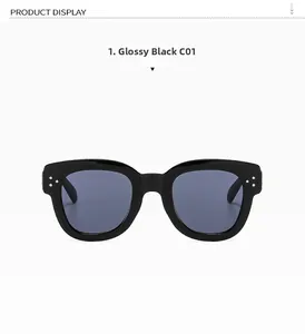 Macro detail of black square sunglasses featuring silver metal rivet decorations and blue lenses