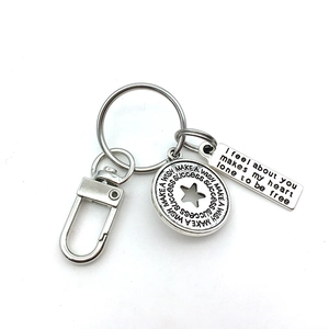 Silver rotating swivel clasp keychain with engraved star pendant and rectangular tag