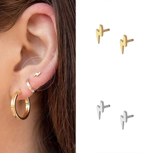 Minimalist lightning bolt stud earrings in gold and silver finish for a modern look