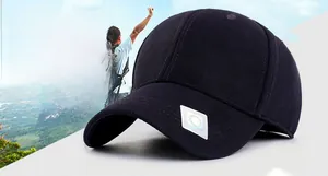 Close-up of black breathable mesh baseball cap with white diamond logo and curved visor