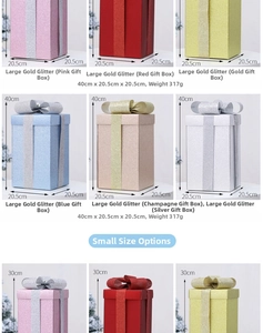 Detail of glitter Christmas gift boxes with festive bows in various colors and sizes