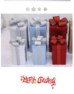 Close-up of matte and glitter Christmas gift boxes in red, blue, silver, and gold colors