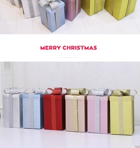 Glitter matte Christmas gift boxes in multiple colors for festive window decoration