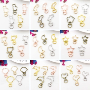 Assortimento di moschettoni in metallo dorato e argento in varie forme per gioielli fai-da-te