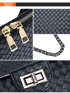 Detail showing black woven texture, golden double zippers, and silver twist lock on bag
