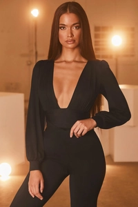 Detailed macro view of black deep V-neck bodysuit with pleated waist and long sleeves