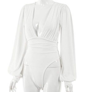 Detail view of white deep V-neck bodysuit with pleated waist and long sleeves on mannequin