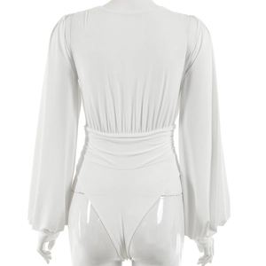 Rear view of white long sleeve bodysuit on mannequin showing ruched details and back cut
