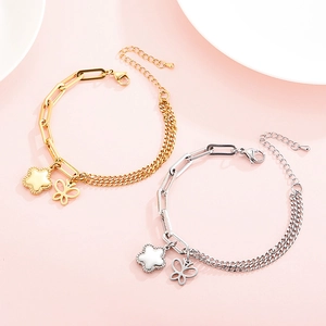 Minimalist titanium steel bracelet with butterfly and flower charms in gold and silver