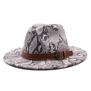 Detailed view of the snakeskin patterned fedora with a brown leather belt and silver buckle