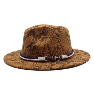 Detail of snake print wool fedora hat featuring blue woven rope and silver anchor buckles