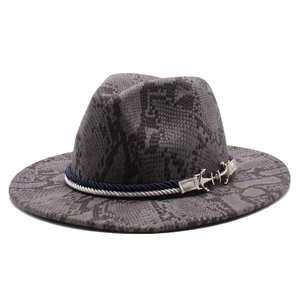 Detail of dark grey snakeskin fedora hat with blue woven cord and silver anchor charm