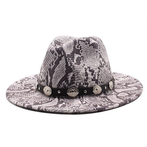 Flat lay of a stylish snake print fedora wool hat with silver studded black band