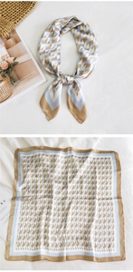 Detailed view of square silk scarf featuring a blue and gold houndstooth pattern and satin texture