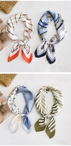 Detailed collage of colorful printed silk scarves with chain and nautical patterns