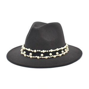 Detail of elegant black wool fedora featuring double-layer pearl chain decorative trim