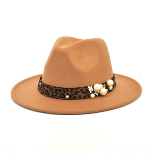 Detail of wide brim fedora in camel wool felt with leopard print band and pearl accents