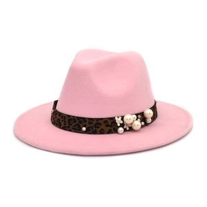 Detail of pink fedora featuring leopard print band with white pearls and floral accents