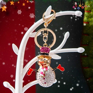 Sparkling Christmas snowman keychain with rhinestones and red enamel on golden alloy base
