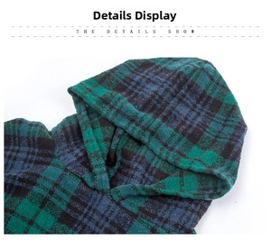 Detail of plaid hooded poncho showing blue and green check pattern and knit texture